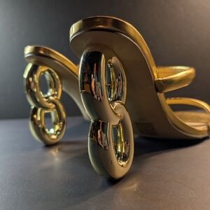 These are gold chain-link heel sandals. Women's 13.5 US 44 Eur Excellent Cond